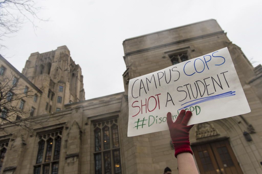 Graduate Students United and community activists chanted outside International House where University of Chicago President Robert Zimmer spoke to undergraduate students, on Thursday, April 5, 2018, in Chicago. Activists hoped to disrupt his speech to brin