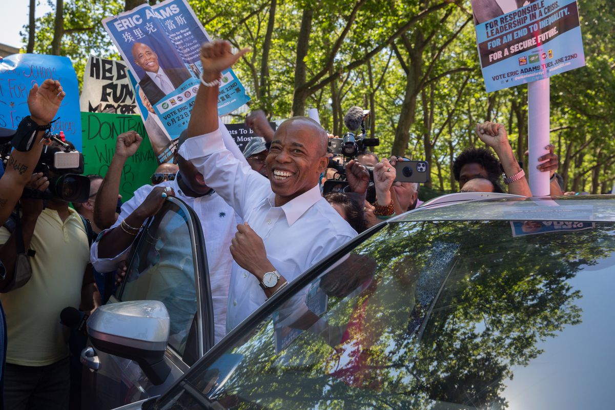 Brooklyn Borough President and mayoral candidate Eric Adams leaves a rally while protesters try to disrupt the event at Cadman Plaza, June 16, 2021.