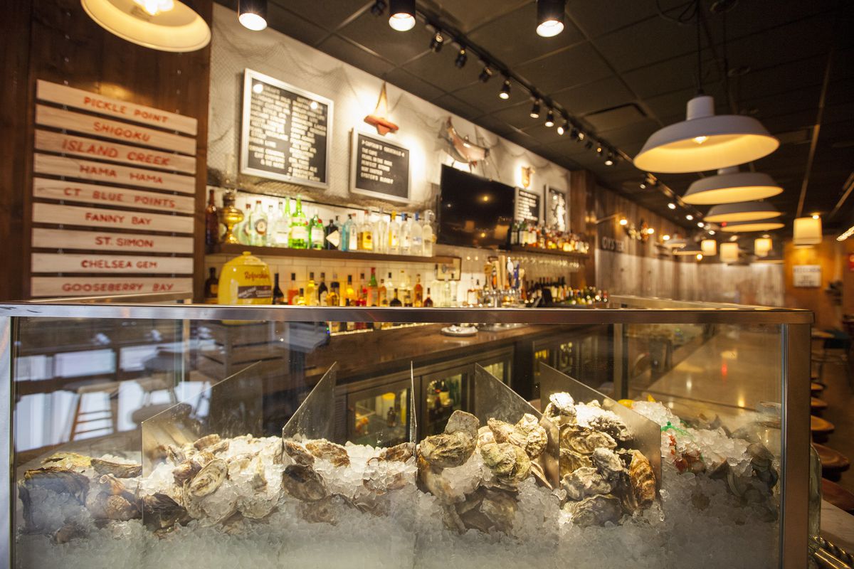 A raw bar inside a casual New England-style seafood restaurant.