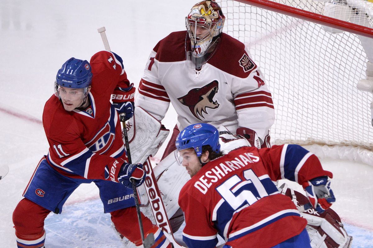 Montreal Canadiens forward Brendan Gallagher (11) and teammate David Desharnais (51) screen Phoenix Coyotes goalie Mike Smith (41) during the second period at the Bell Centre.