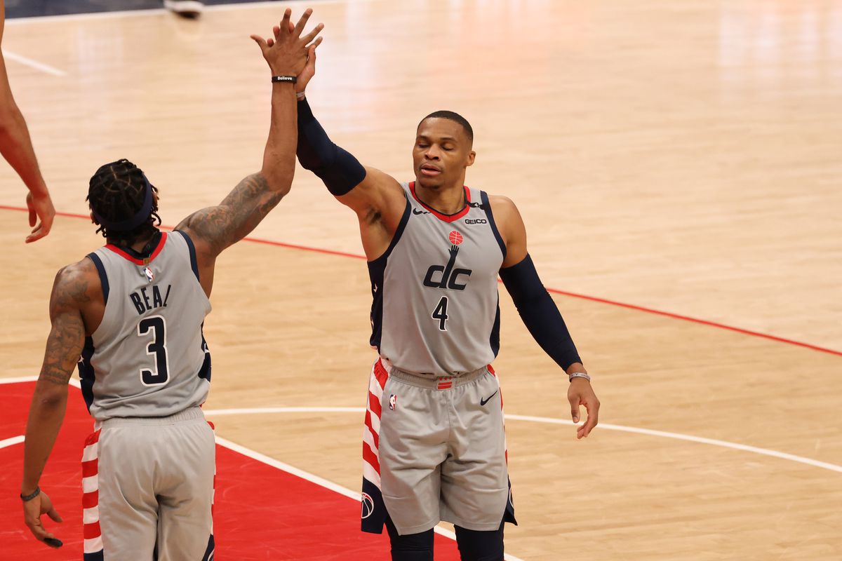 Washington Wizards guard Bradley Beal celebrates with Wizards guard Russell Westbrook against the Utah Jazz in the fourth quarter at Capital One Arena.