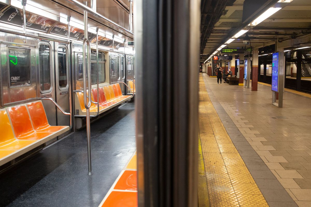 An empty 6 train sits at the City Hall station during the coronavirus epidemic.