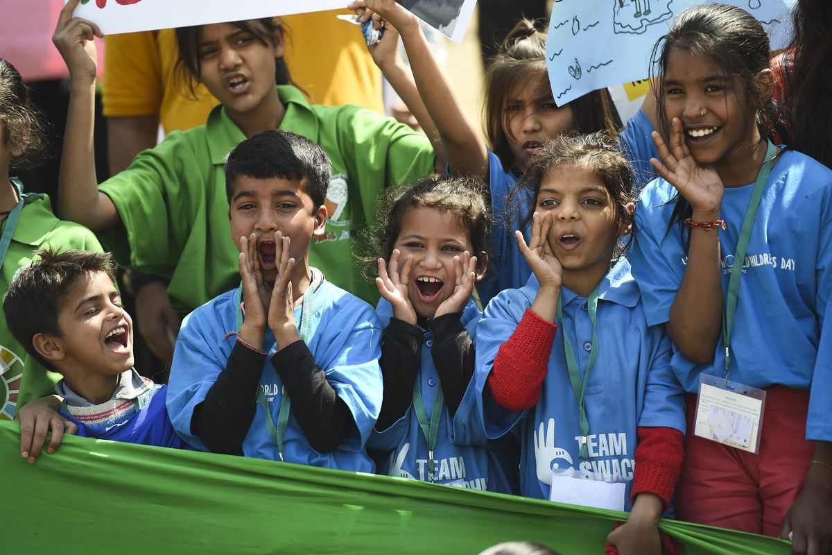 Indian school students shout slogans during a protest against global warming in New Delhi on March 15, 2019. 
