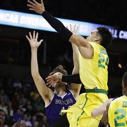Oregon forward Dillon Brooks (24) shoots against Holy Cross center Matt Husek (42) during the second half of a first-round men's college basketball game in the NCAA Tournament in Spokane, Wash., Friday, March 18, 2016. Oregon won 91-52. (AP Photo/Young Kwak)