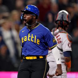 Taylor Trammell #5 of the Seattle Mariners celebrates his run against the Houston Astros during the fifth inning at T-Mobile Park on May 05, 2023 in Seattle, Washington.