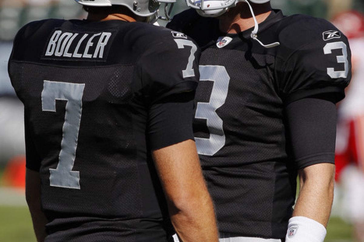 OAKLAND, CA - OCTOBER 23:  Carson Palmer #3 of the Oakland Raiders talks with Kyle Boller #7 before a game against the Kansas City Chiefs on October 23, 2011 at O.co Coliseum in Oakland, California.   (Photo by Brian Bahr/Getty Images)