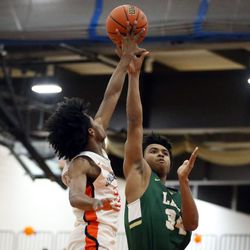 Whitney Young’s D.J. Steward (21) blocks the shot of Lane Tech’s Keith O’Conor (34) in their 58-49 Class 4A Section Championship win in Chicago Friday, March 1, 2019. | Kevin Tanaka/For the Sun Times