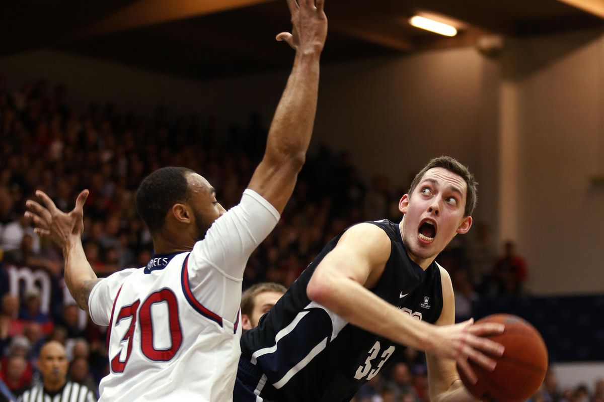 Gonzaga forward Kyle Wiltjer, right, looks to shoot the ball over St. Mary's forward Desmond Simmons during the first half of an NCAA college basketball game Saturday, Feb. 21, 2015, in Moraga, Calif.  