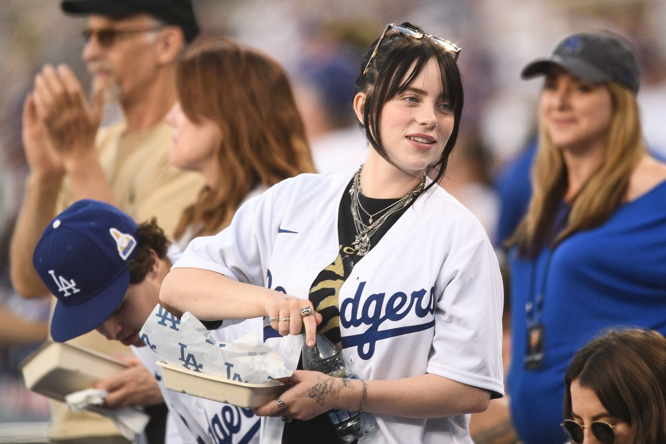 Billie Eilish wearing a Dodgers uniform