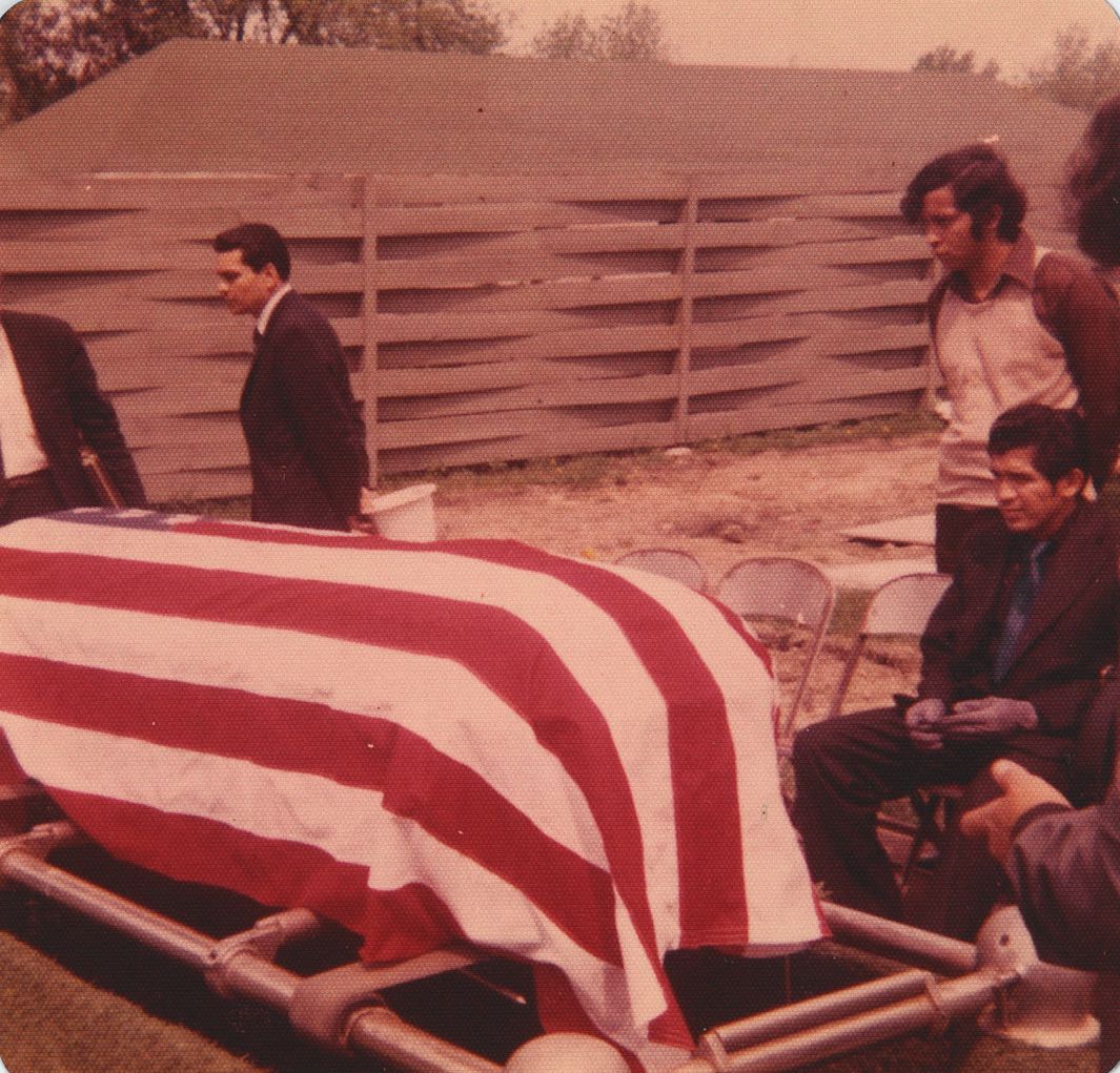 David “Boogie” Gonzalez (right) looks on as his brother Jacob Gonzels is laid to rest on May 18, 1971.