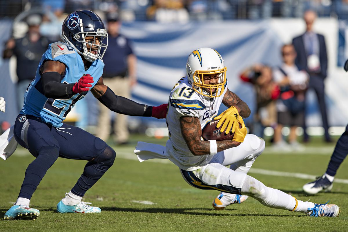 Keenan Allen of the Los Angeles Chargers catches a pass and is hit by Logan Ryan of the Tennessee Titans at Nissan Stadium on October 20, 2019 in Nashville, Tennessee.