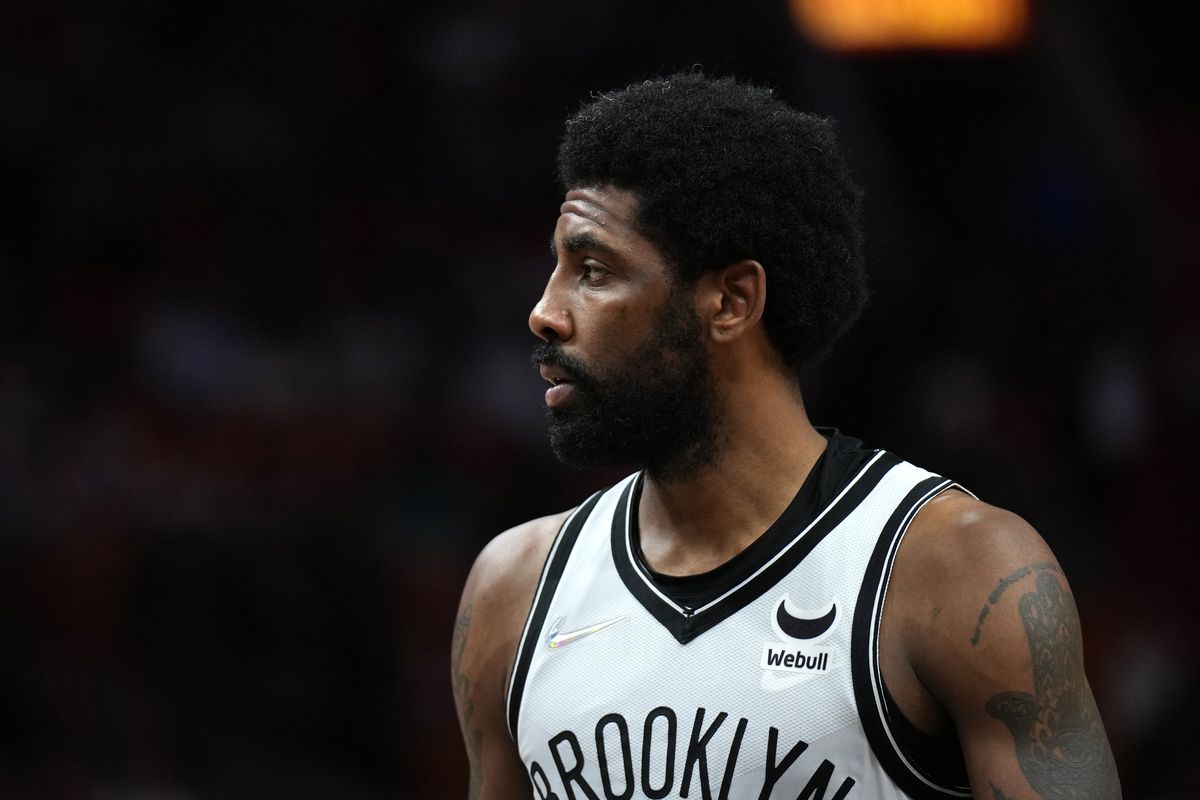 Kyrie Irving #11 of the Brooklyn Nets looks on during the game against the Miami Heat on February 12, 2022 at FTX Arena in Miami, Florida.&nbsp;