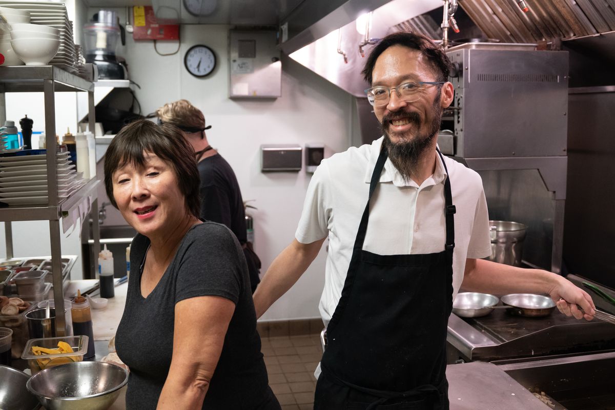 Chef Brian Mita, right, and his mother, Helen, in the kitchen of their restaurant Izakaya Mita in Bucktown on Oct. 9, 2021.