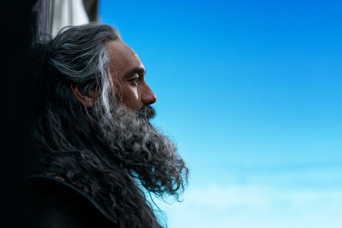 Taika Waititi as Blackbeard brooding in the vivid blue sky in Our Flag Means Death