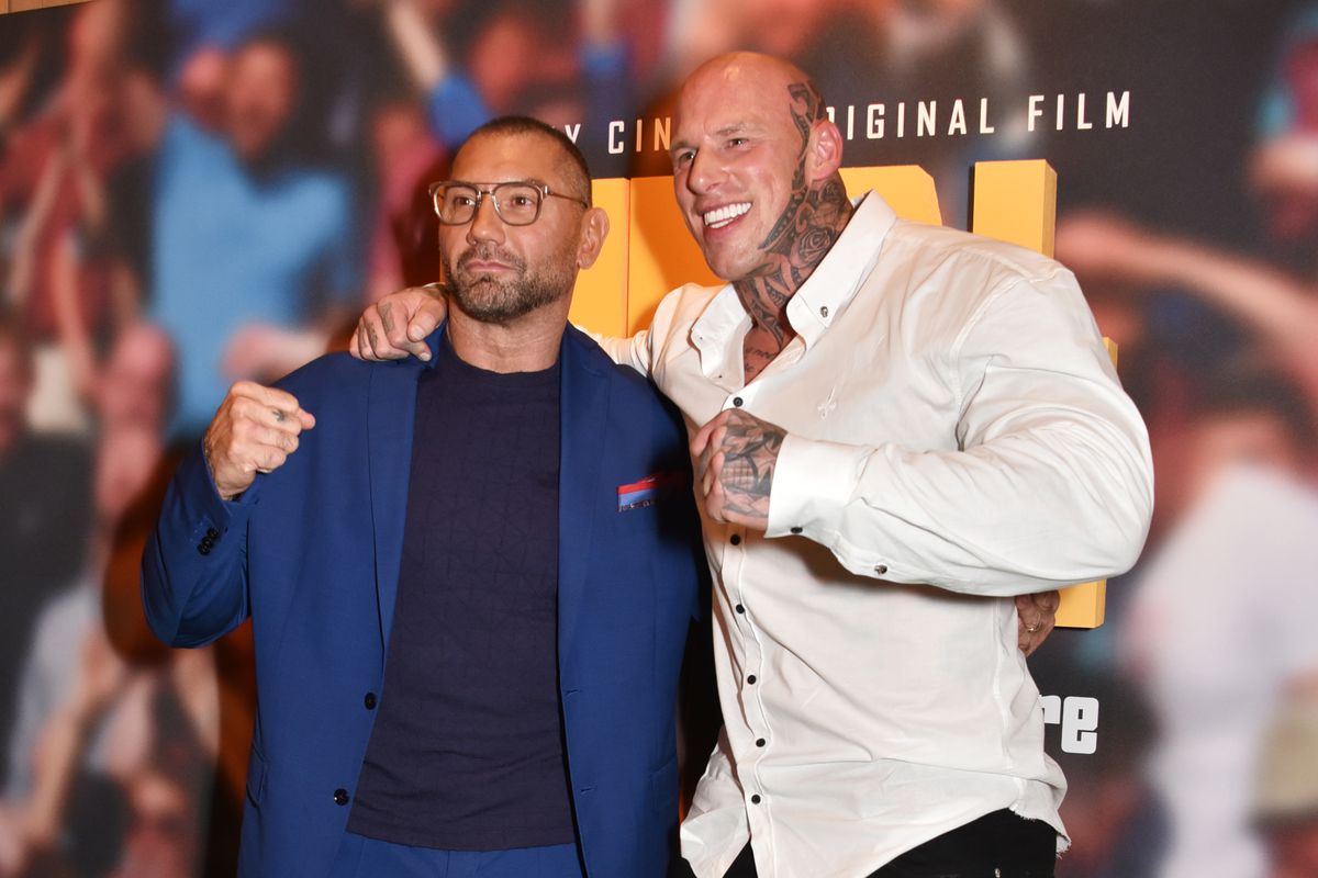 Dave Bautista and Martyn Ford posing side by side as they attend the premiere of Final Score in 2018 in London, England.