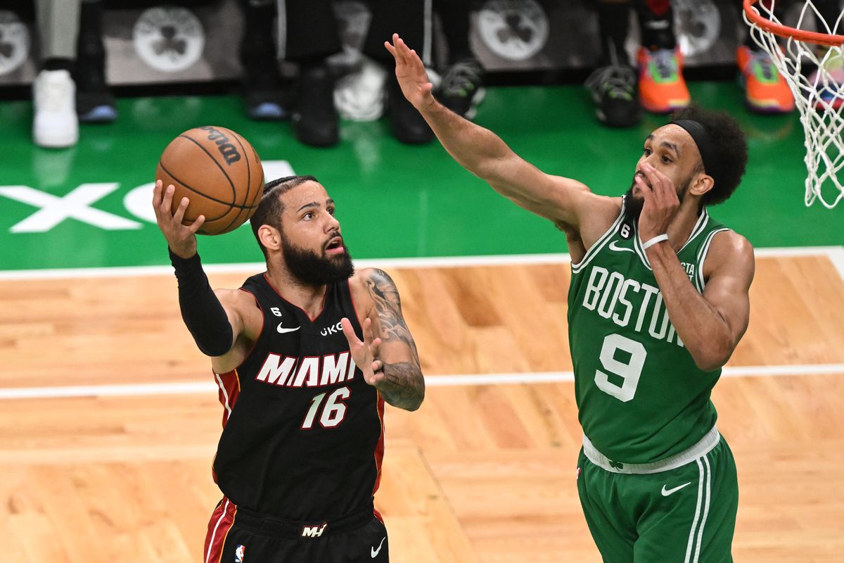 Miami Heat forward Caleb Martin (16) shoots against Boston Celtics guard Derrick White (9) in the first quarter during game five of the Eastern Conference Finals for the 2023 NBA playoffs at TD Garden.&nbsp;