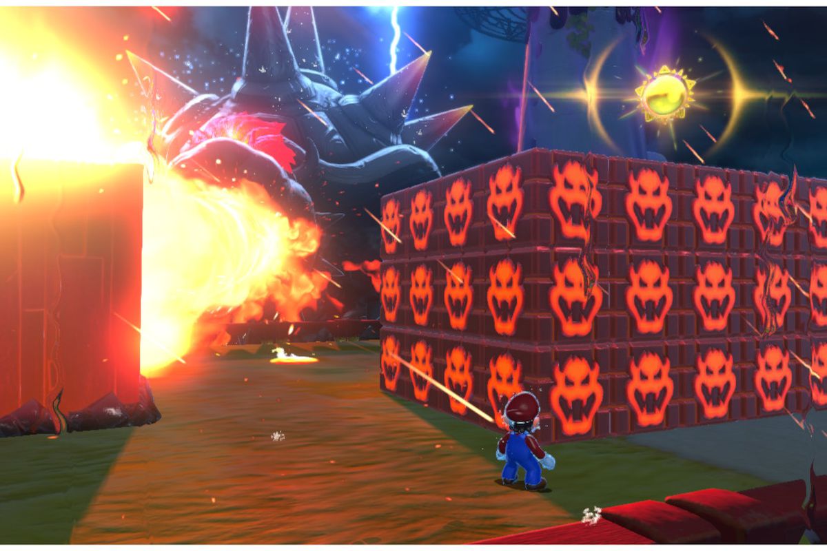 Fury Bowser spews fire as Mario stands behind a chunk of glowing blocks with Bowser’s face on them