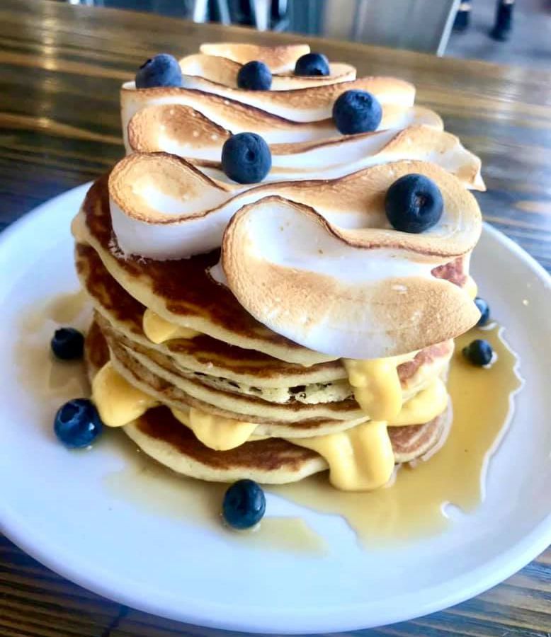 A stack of pancakes with meringue on top
