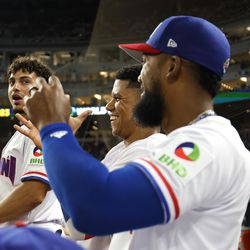 Willy Adames #1, Juan Soto #22, and Teoscar Hernández #37 of Team Dominican Republic look on against Team Israel during their World Baseball Classic Pool D game at loanDepot park on March 14, 2023 in Miami, Florida.