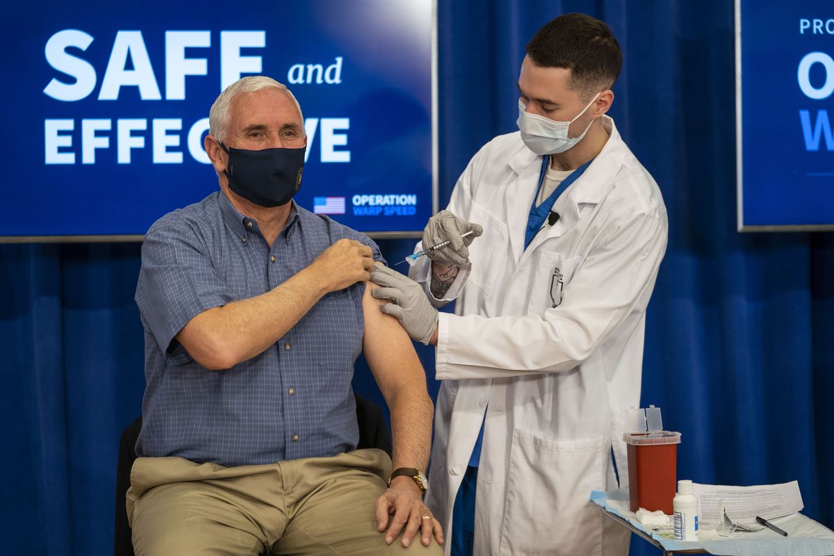 Former Vice President Mike Pence receives a COVID-19 vaccine.