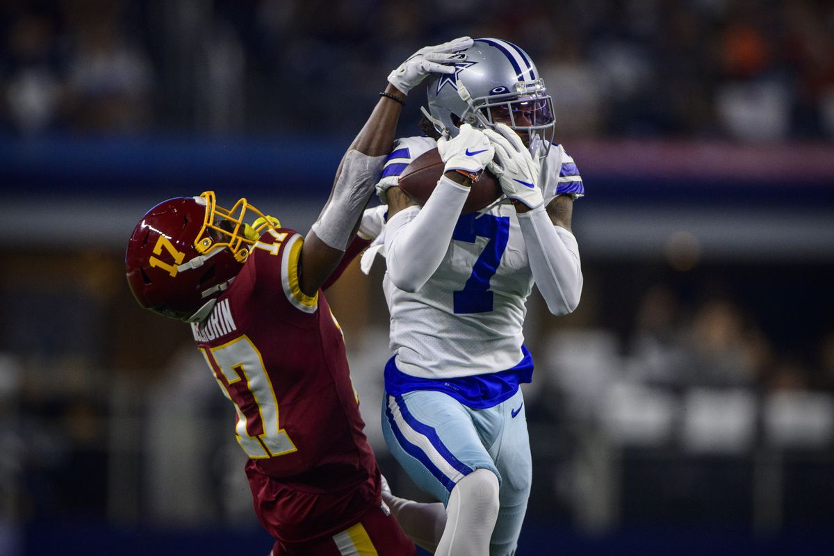 Dallas Cowboys cornerback Trevon Digg (7) intercepts a pass intended for Washington Football Team wide receiver Terry McLaurin (17) during the first quarter at AT&amp;T Stadium.