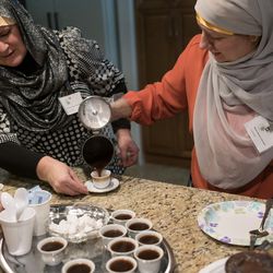 Izeta Ibrahimovic, left, and Amina Bejtovic, right, prepare Bosnian coffee for guests after a ceremony marking the completion of renovations of the Islamic Society of Bosniaks mosque in Salt Lake City on Saturday, Dec. 10, 2016. The mosque, which serves the area's Bosnian Muslim community, is named Maryam after the mother of Jesus.