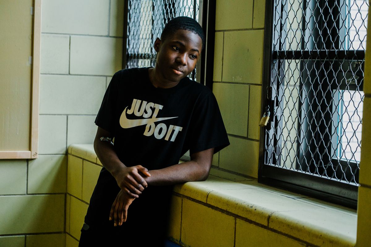 FRIDAY, APRIL 9, 2021- Brooklyn, New York: Alandinio Cineas, 16, stands in the hallway at Brooklyn High School for Excellence and Equity in Canarsie. CREDIT: Gabriela Bhaskar for Chalkbeat