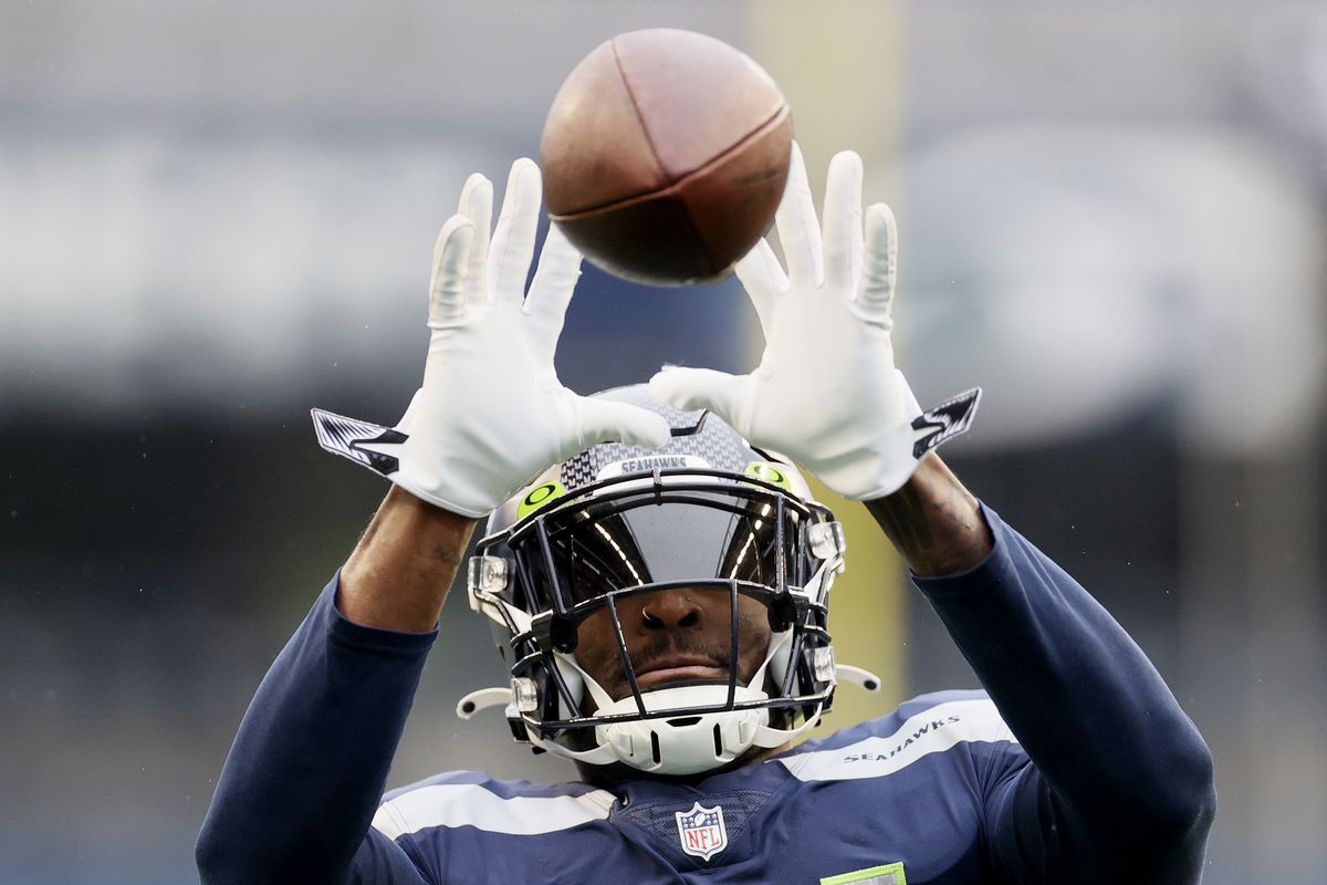 DK Metcalf #14 of the Seattle Seahawks warms up before the game against the Detroit Lions at Lumen Field on January 02, 2022 in Seattle, Washington.