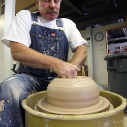 Local artist Eric Christiansen sculpts pottery at the Park City Kimball Arts Festival in Park City on Saturday, Aug.  4, 2012.