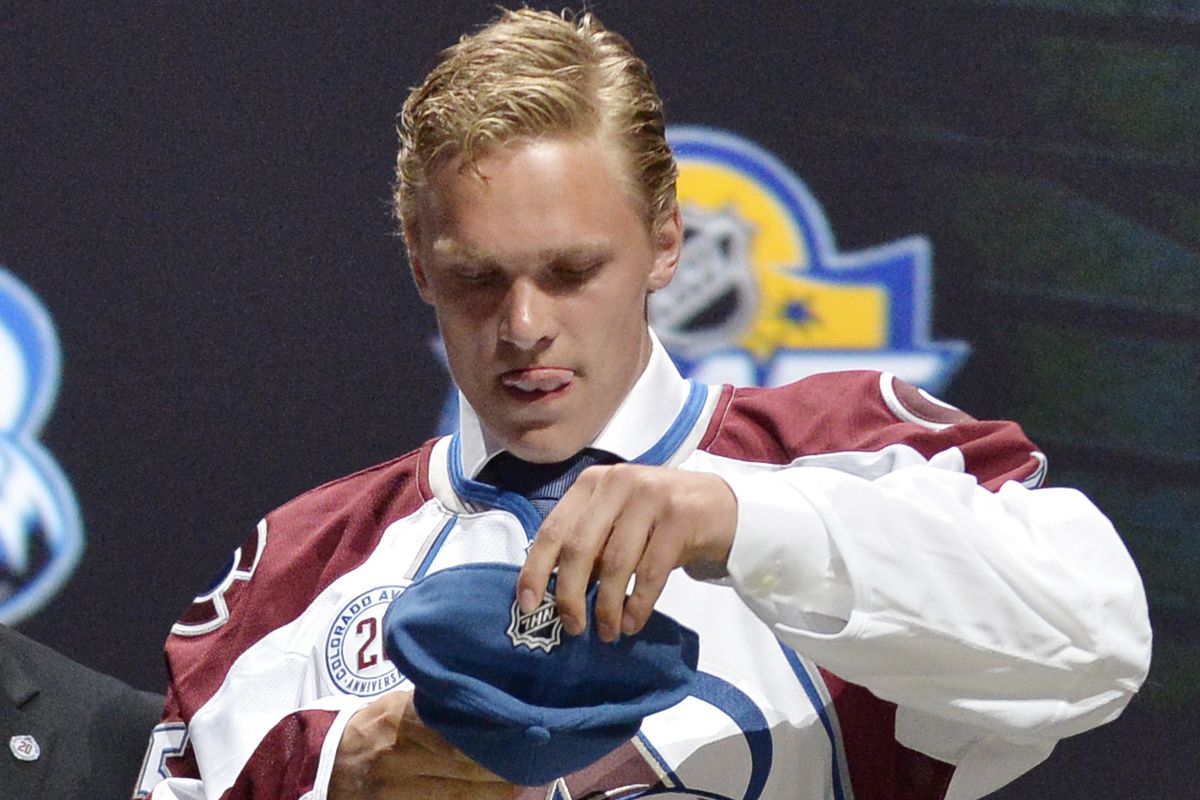 New Avs prospect Mikko Rantenen focuses just extraordinarily hard on this putting on a hat thing.