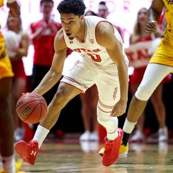 Utah Utes guard Sedrick Barefield (0) scoops up a loose ball and starts to drive against the California Golden Bears at the Huntsman Center in Salt Lake City on Saturday, Feb. 10, 2018.