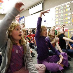 Sophie Mertlich, front left, and Ariel Harp participate in Alisa Wu's third grade Chinese immersion class at Lone Peak Elementary School in Sandy, Thursday, Jan. 12, 2012. 