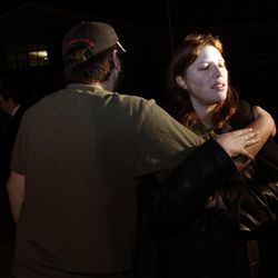 Andrew Olsen embraces his fiancee, Denise Cox, at a memorial to Braden and Charlie Powell, Denise's nephews, at Emma L. Carson Elementary School in Puyallup, Wash., Sunday, Feb. 5, 2012.