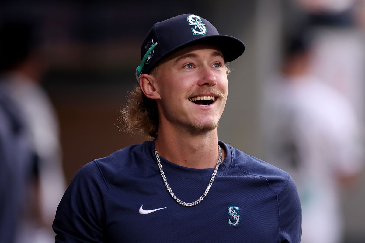 Bryce Miller #50 of the Seattle Mariners looks on in the dugout against the Washington Nationals at T-Mobile Park on June 27, 2023