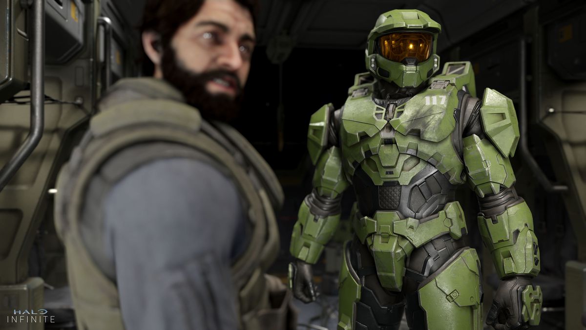 a dark-haired bearded man and Master Chief look to the right in Halo Infinite