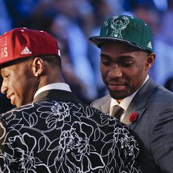 Andrew Wiggins, left, and Jabari Parker stop for television interviews after being selected as the top two picks in the 2014 NBA draft, Thursday, June 26, 2014, in New York. Wiggins was selected number one by the Cleveland Cavaliers and Parker was chosen number two by the Milwaukee Bucks. 