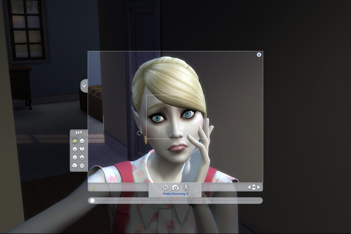 A sim vampire looks desolate into the camera while taking a selfie in The Sims 4.