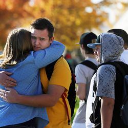 FILE — Families reunite at Mountain View High School in Orem on Tuesday, Nov. 15, 2016, after five students were stabbed in an apparent attack by a 16-year-old boy.
