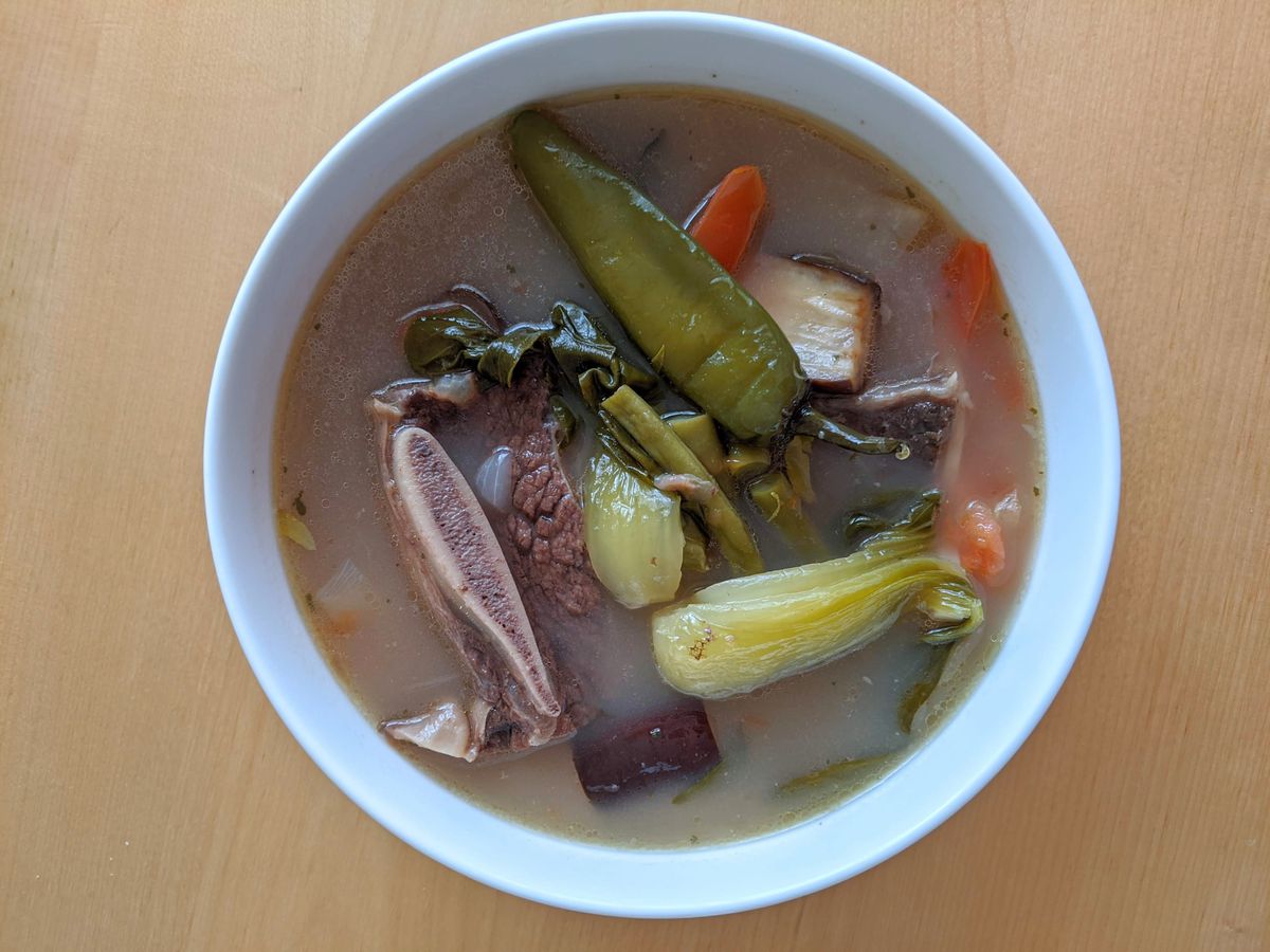 Short rib sinigang — a opaque broth studded with vegetables and pieces of bone-in short rib — at Chibog