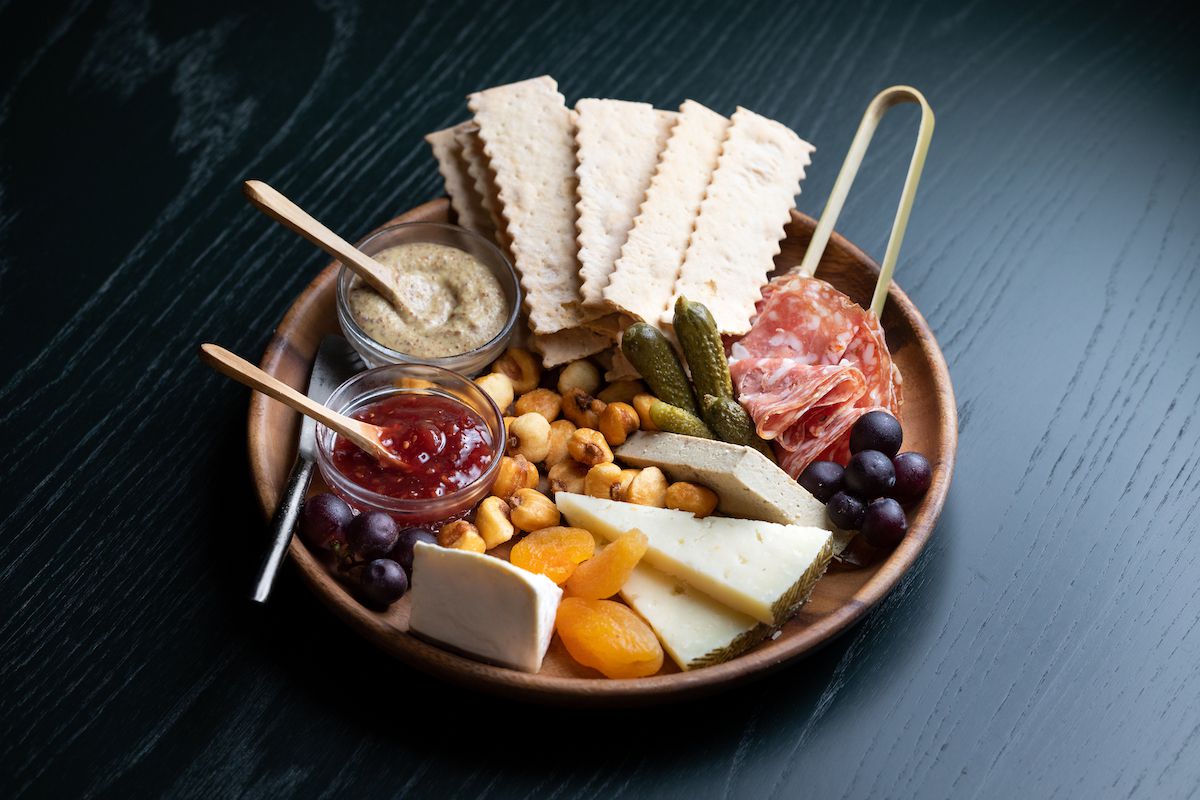 A charcuterie and cheese selection on a plate at Agnes in Pasadena, California.