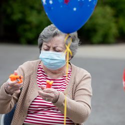 Carol Knighton reloads her toy Nerf gun during an activity to keep seniors entertained while quarantining amid the COVID-19 pandemic at Chancellor Gardens in Clearfield on Thursday, May 14, 2020.
