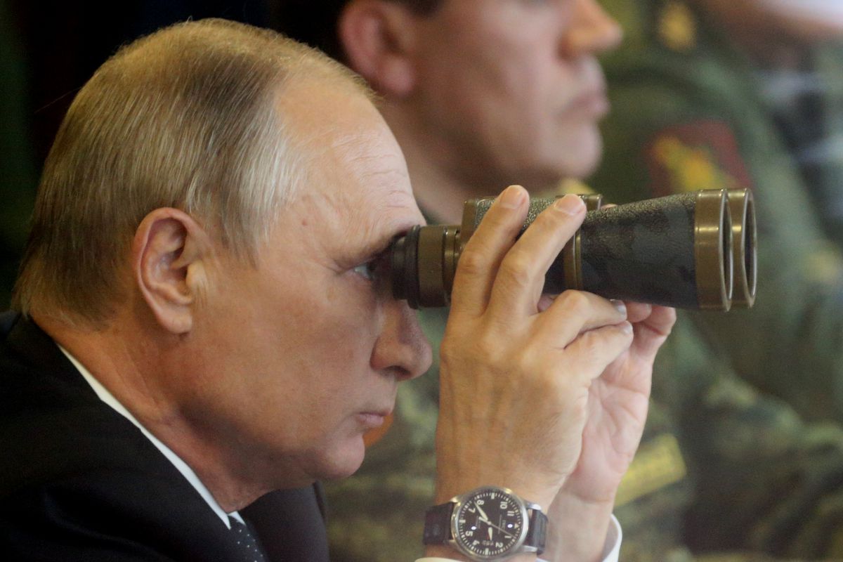 Russian President Vladimir Putin watches a military exercise at a training ground at Luzhsky range near Saint Petersburg, Russia, on Sep. 18, 2017.