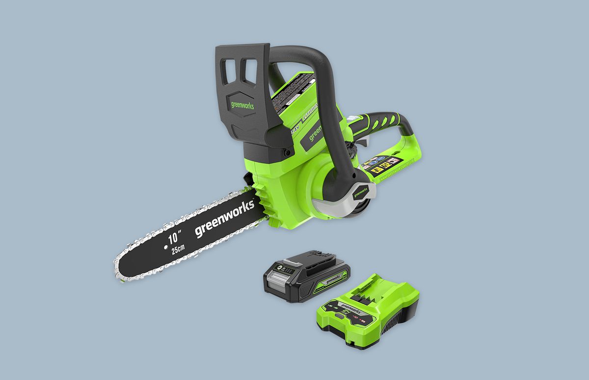 Greenworks 24V 10-Inch Chainsaw&nbsp;with battery and charger on blue background