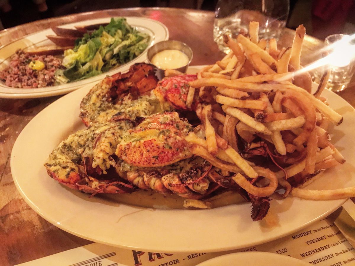 Lobster and fries on a white plate