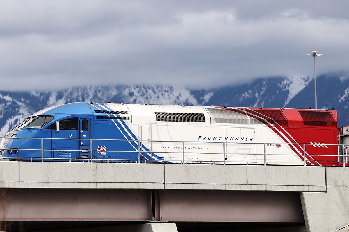 A southbound FrontRunner train crosses 9000 South in Sandy on Friday, Feb. 12, 2021. Double-tracking FrontRunner is one of the infrastructure projects being considered in the Legislature’s budget talks.