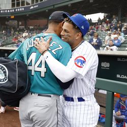 Christopher Morel #5 of the Chicago Cubs hugs Julio Rodriguez #44 of the Seattle Mariners before the spring training game at Sloan Park on March 01, 2023 in Mesa, Arizona