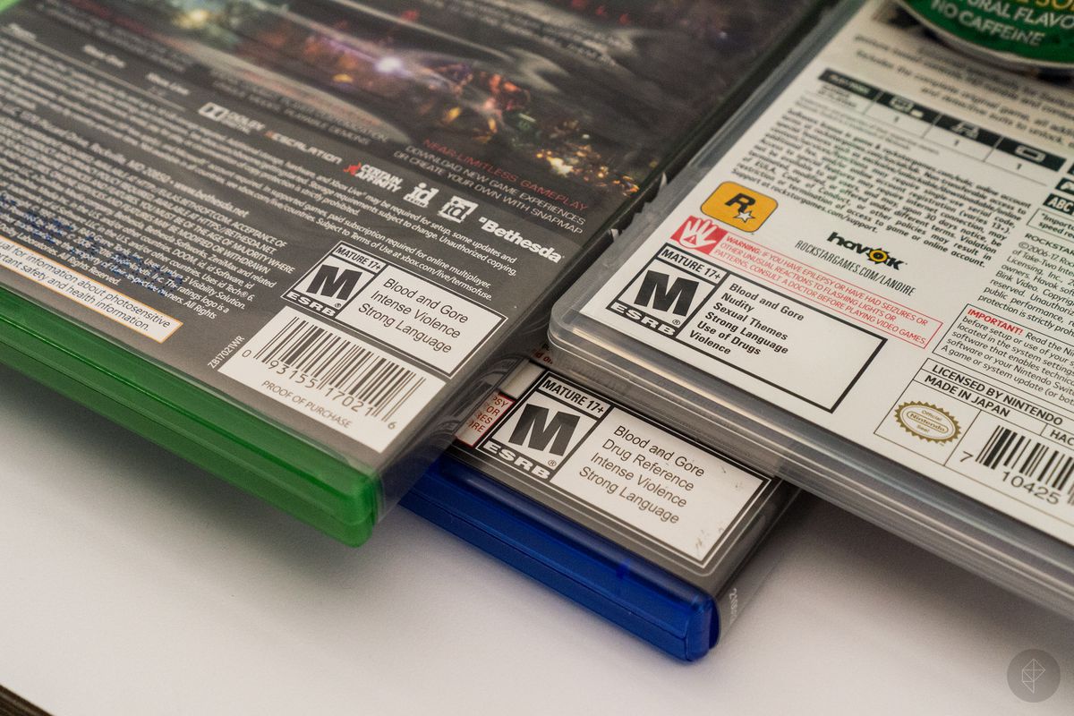 close-up of ESRB M rating on back of three game boxes
