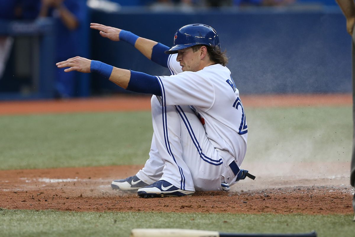 Colby Rasmus slides (or something) into home.