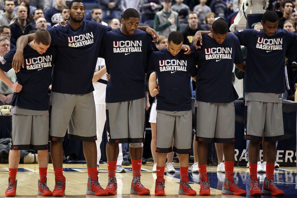 HARTFORD, CT - JANUARY 29:  The Connecticut Huskies stand as the national anthem is played before the game against the Notre Dame Fighting Irish on January 29, 2012 at the XL Center in Hartford, Connecticut.  (Photo by Elsa/Getty Images)