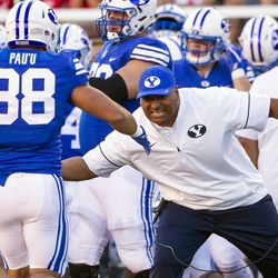 Brigham Young Cougars head coach Kalani Sitake celebrates with Brigham Young Cougars linebacker Butch Pau'u (38) after the Cougars forced a turnover against the Utah Utes during an NCAA football game in Salt Lake City on Saturday, Sept. 10, 2016. Utah leads rival BYU 14-13 at halftime.